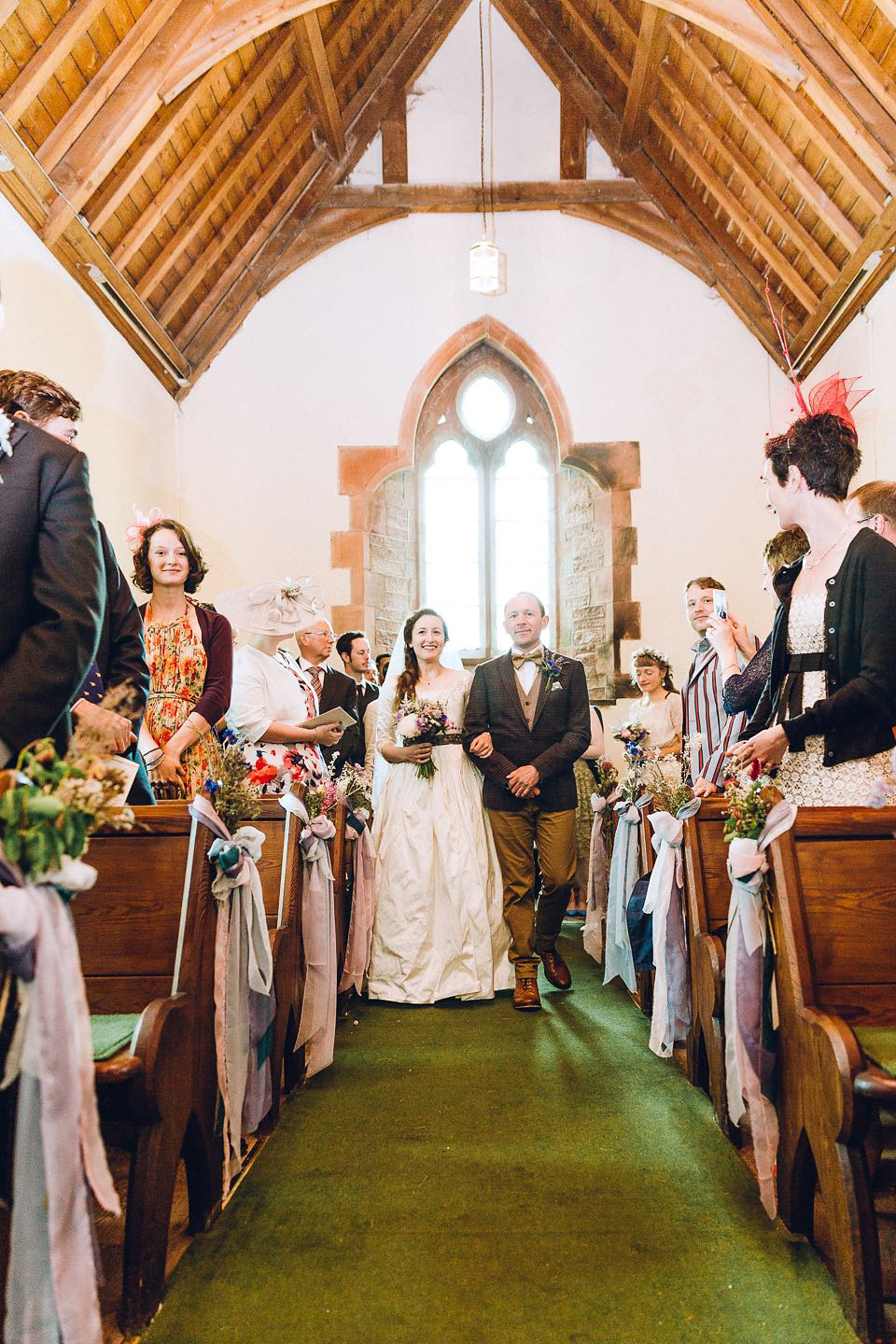 Hannah wore a Regency period inspired dress she made herself for her homemade village hall wedding. Photography by Ash James.