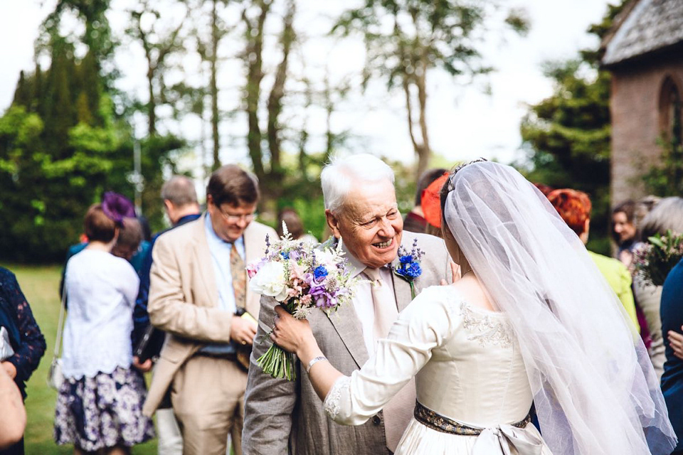 Hannah wore a Regency period inspired dress she made herself for her homemade village hall wedding. Photography by Ash James.