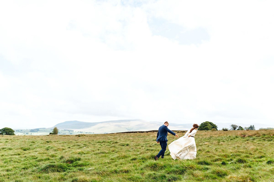 Hannah wore a Regency period inspired dress she made herself for her homemade village hall wedding. Photography by Ash James.