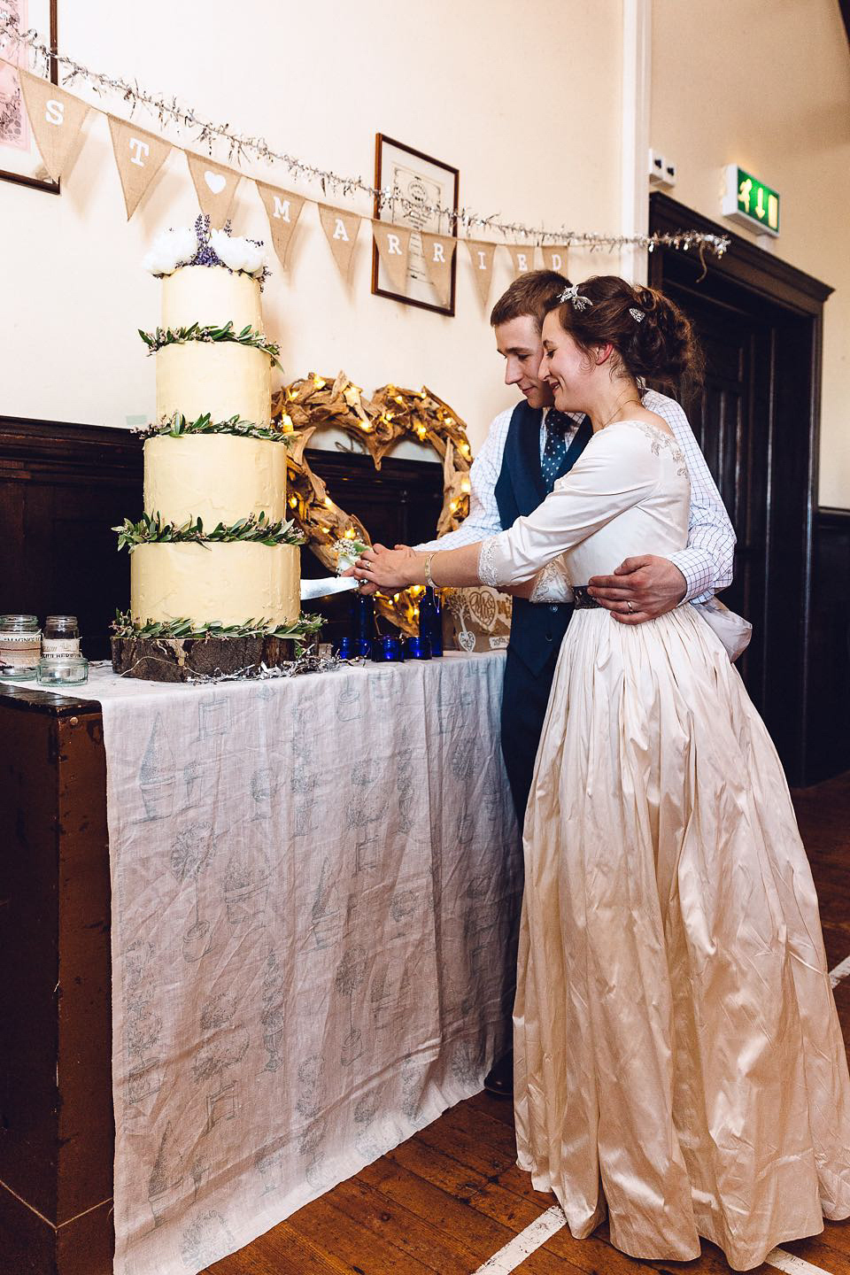 Hannah wore a Regency period inspired dress she made herself for her homemade village hall wedding. Photography by Ash James.