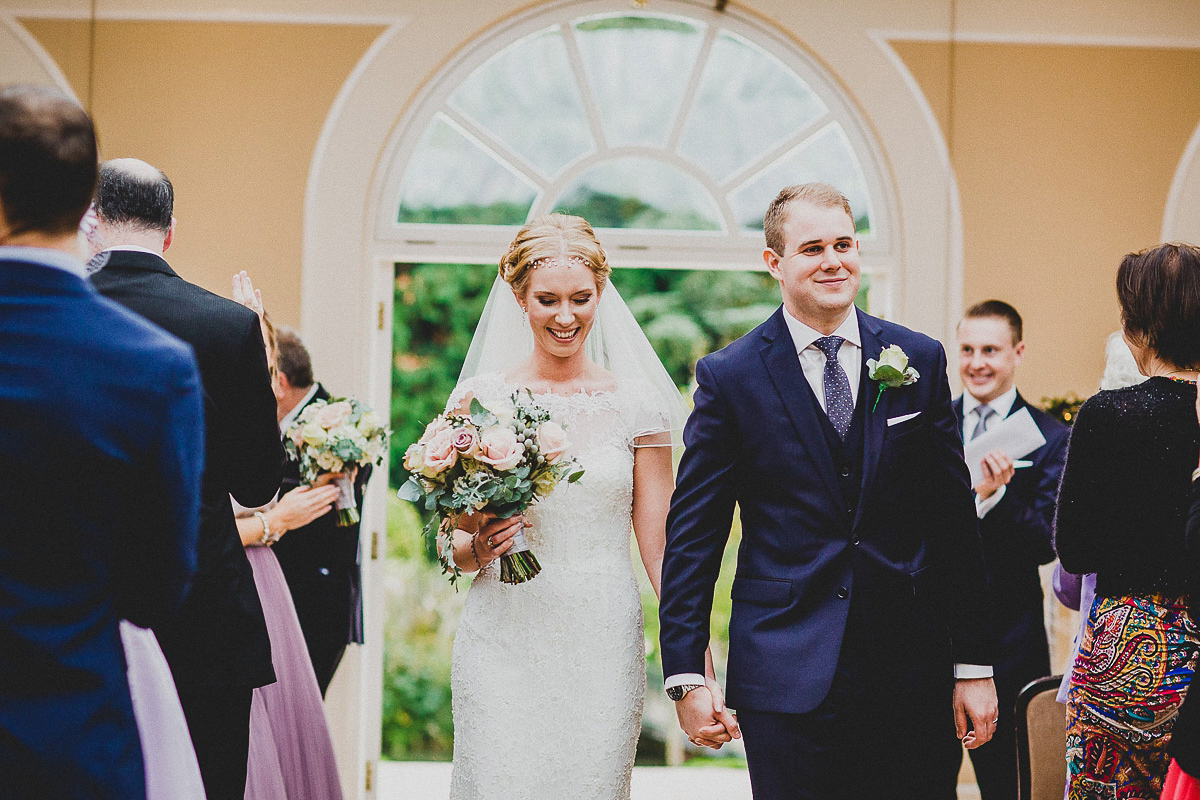 Charlie wore an Annsul Y gown and Rosie Willett headpiece for her Elegant Autumn wedding at the Orangery in Kent. Photography by Jonny MP.