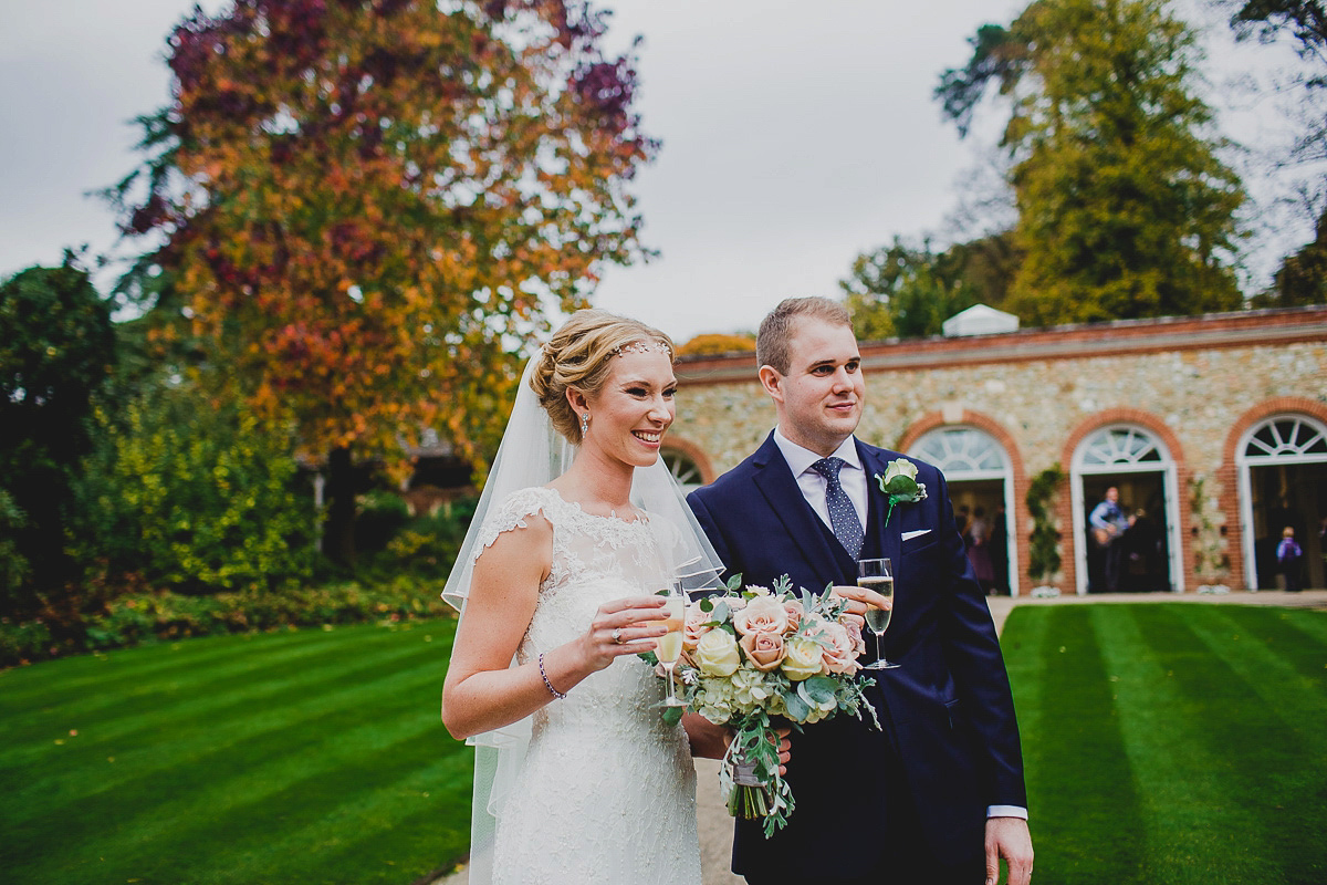 Charlie wore an Annsul Y gown and Rosie Willett headpiece for her Elegant Autumn wedding at the Orangery in Kent. Photography by Jonny MP.