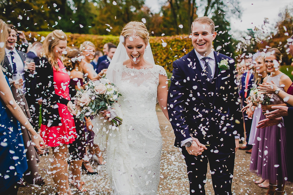 Charlie wore an Annsul Y gown and Rosie Willett headpiece for her Elegant Autumn wedding at the Orangery in Kent. Photography by Jonny MP.
