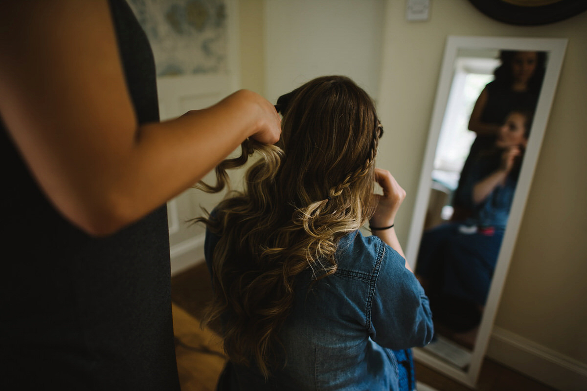 Saskia wore a Halfpenny London gown with feathered sleeves for her nature inspired wedding in Scotland. Photography by Lisa Devine.