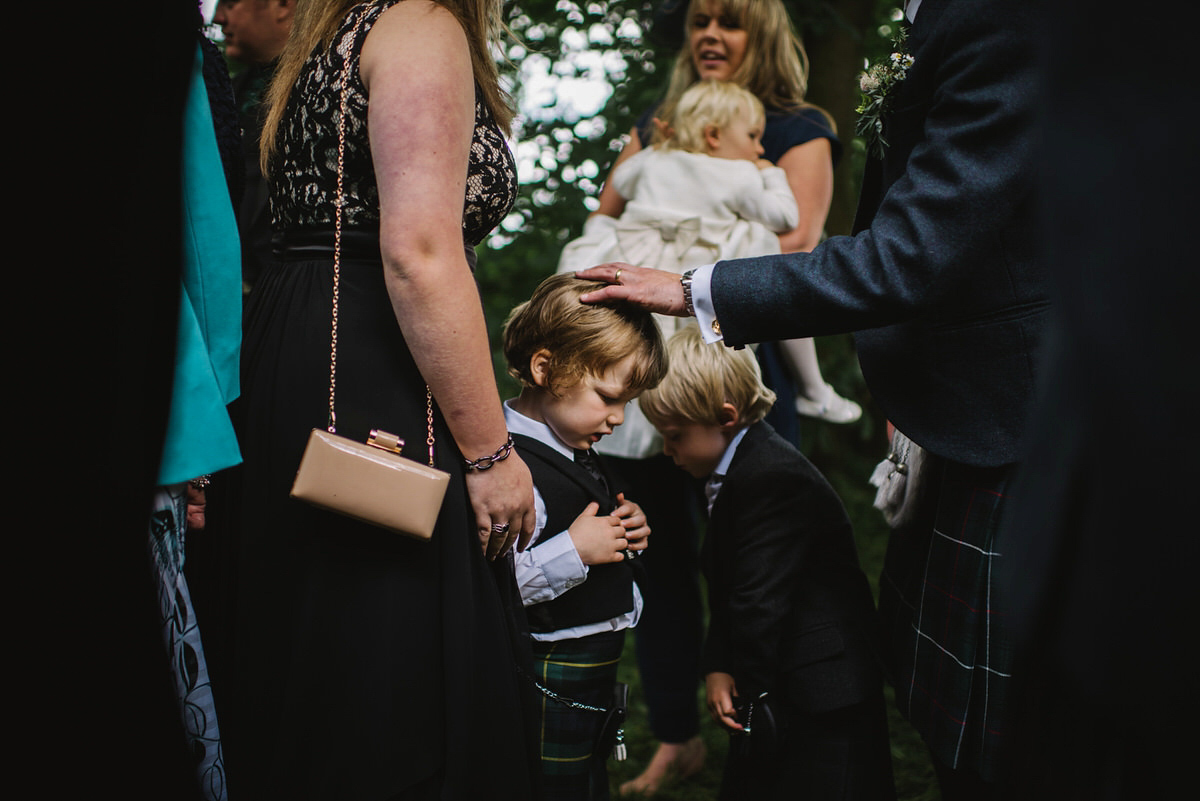 Saskia wore a Halfpenny London gown with feathered sleeves for her nature inspired wedding in Scotland. Photography by Lisa Devine.