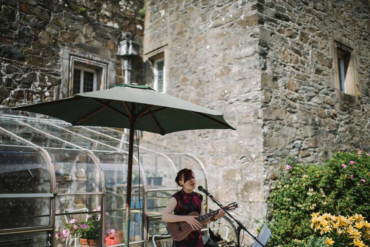 Saskia wore a Halfpenny London gown with feathered sleeves for her nature inspired wedding in Scotland. Photography by Lisa Devine.