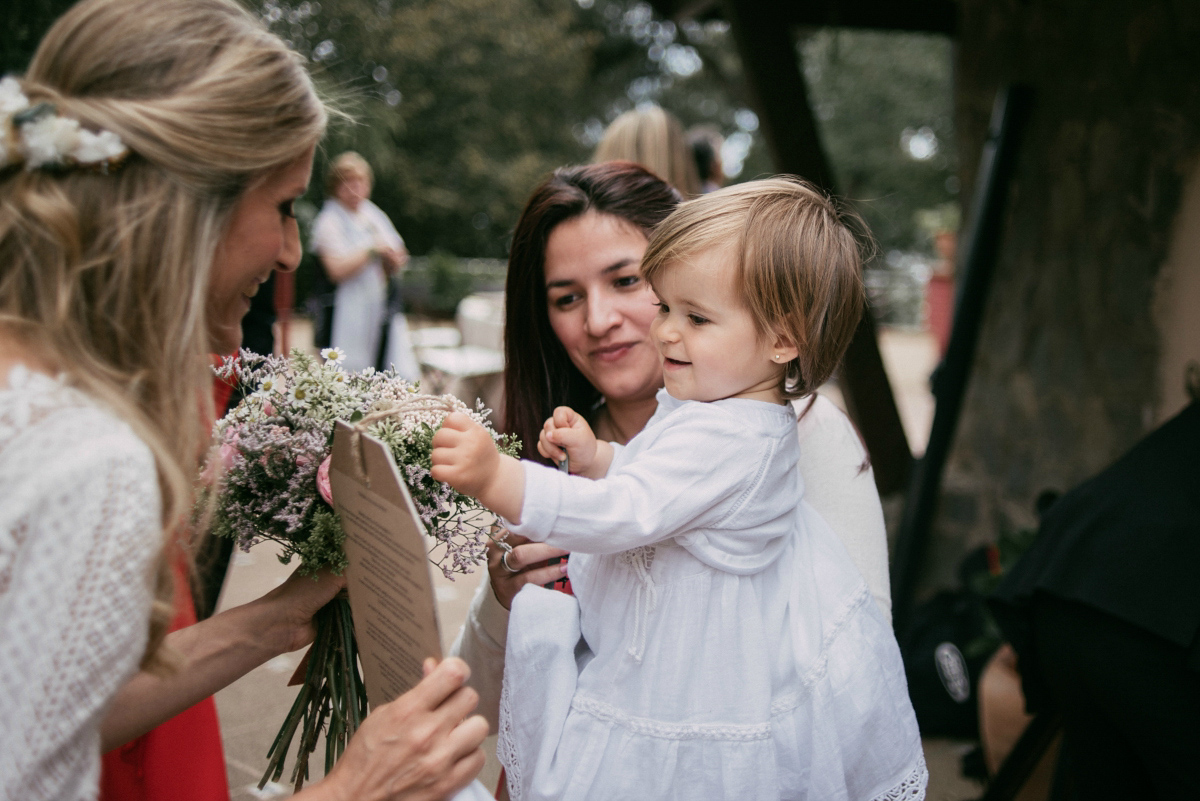 Bride Margarita wore a backless dress for her rustic woodland wedding in Spain. Photography by Sarah Lobla.