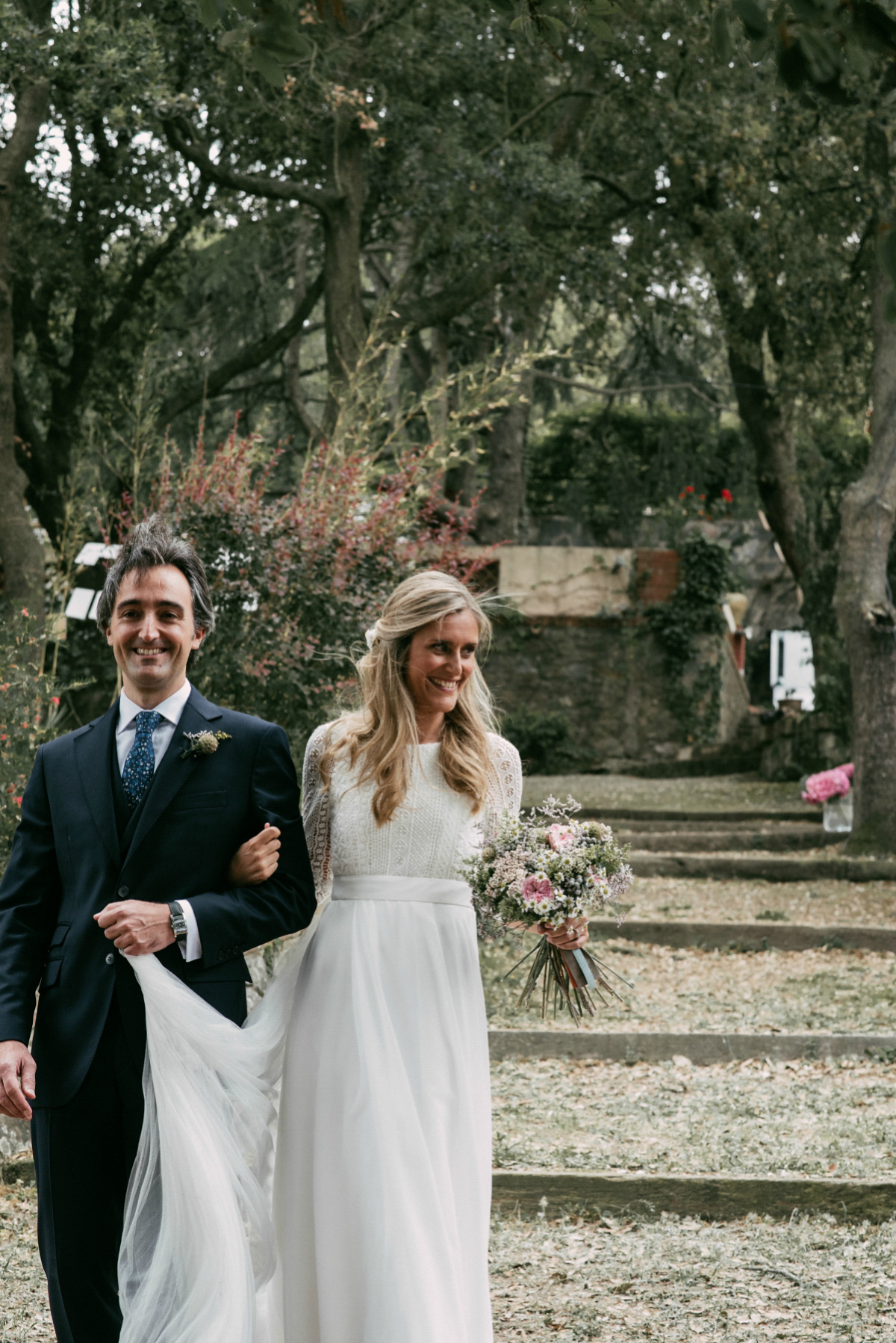 Bride Margarita wore a backless dress for her rustic woodland wedding in Spain. Photography by Sarah Lobla.