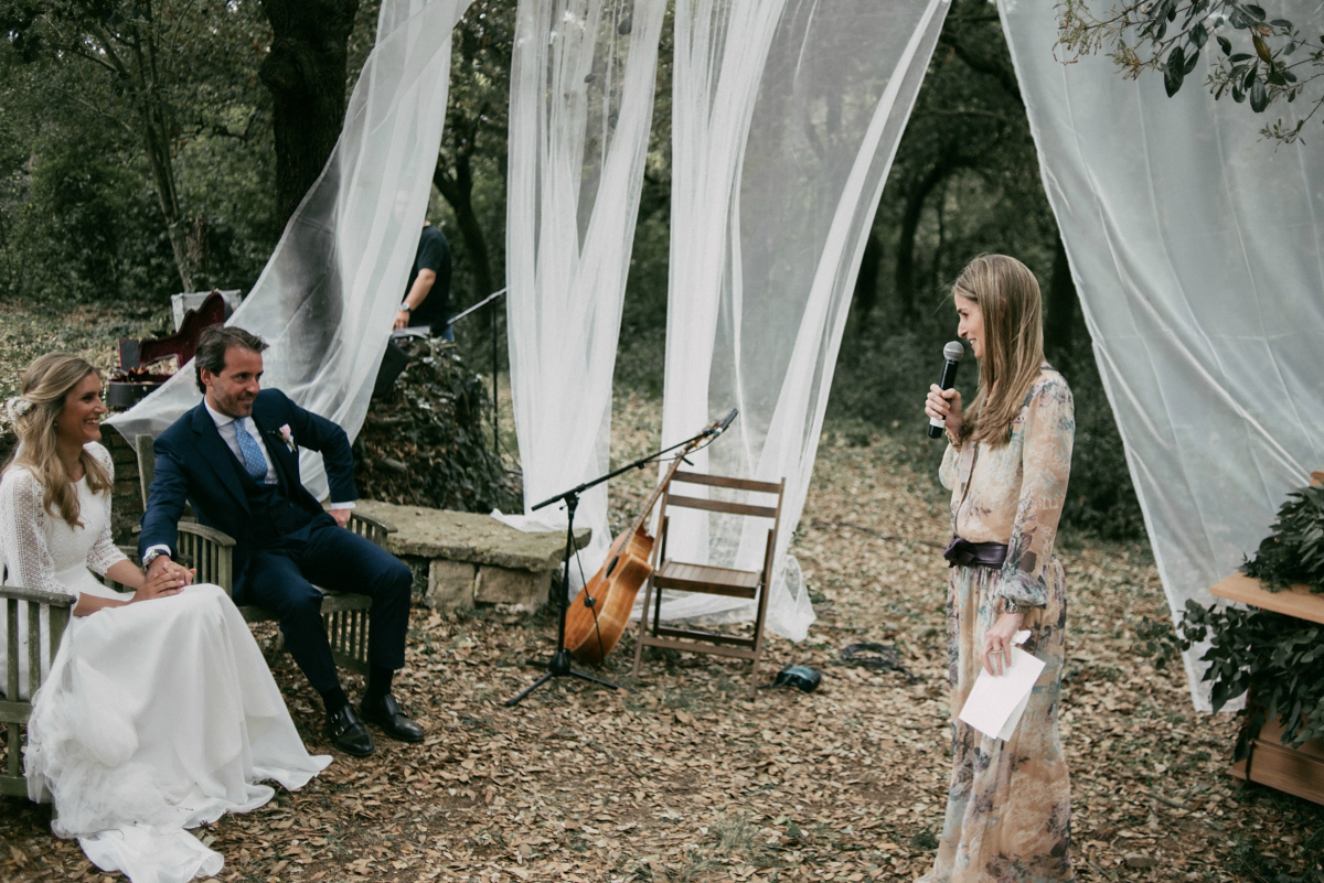 Bride Margarita wore a backless dress for her rustic woodland wedding in Spain. Photography by Sarah Lobla.