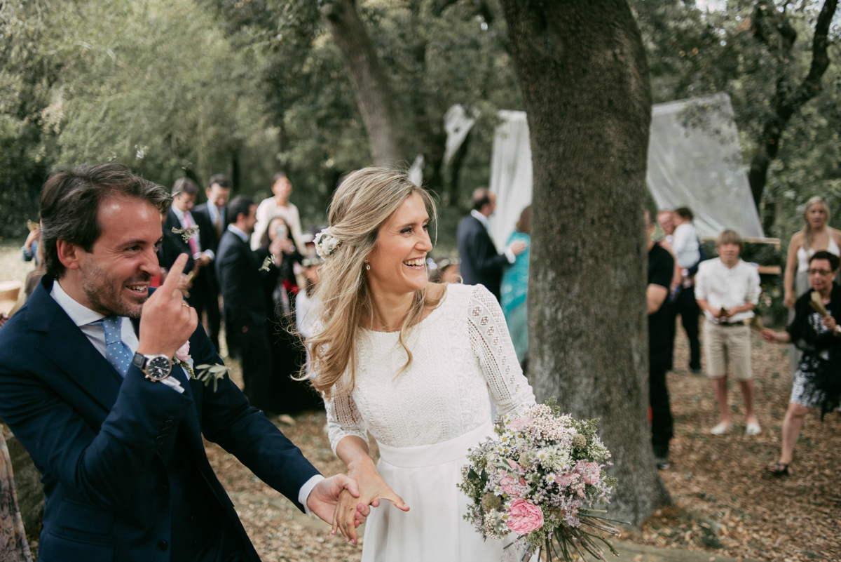 Bride Margarita wore a backless dress for her rustic woodland wedding in Spain. Photography by Sarah Lobla.