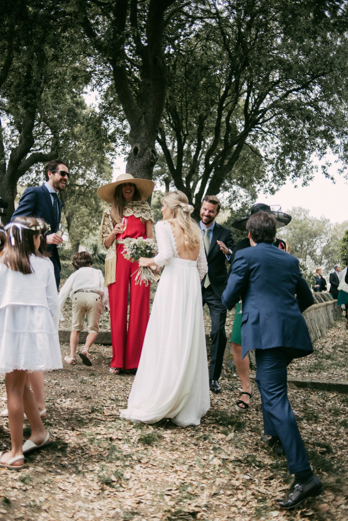 Bride Margarita wore a backless dress for her rustic woodland wedding in Spain. Photography by Sarah Lobla.