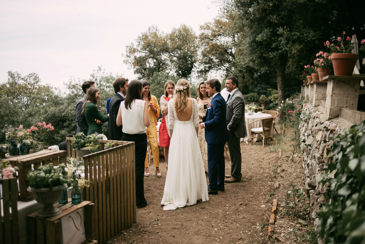 Bride Margarita wore a backless dress for her rustic woodland wedding in Spain. Photography by Sarah Lobla.