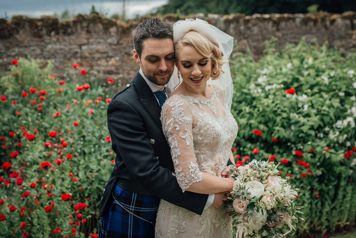 Megan wore Maggie Sottero for her American-English and travel inspired wedding in Scotland. Images captued by ChicPhoto.