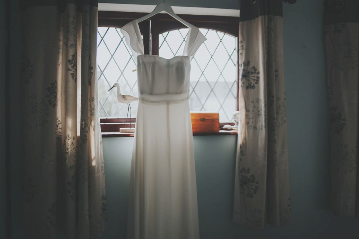 Anya wore a Sabina Motasem gown and floral crown for her vintage seaside inspired wedding. Photography by Eliza Claire.