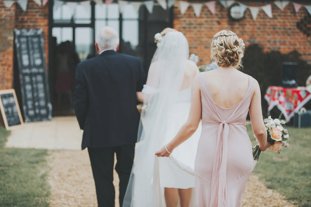 Anya wore a Sabina Motasem gown and floral crown for her vintage seaside inspired wedding. Photography by Eliza Claire.