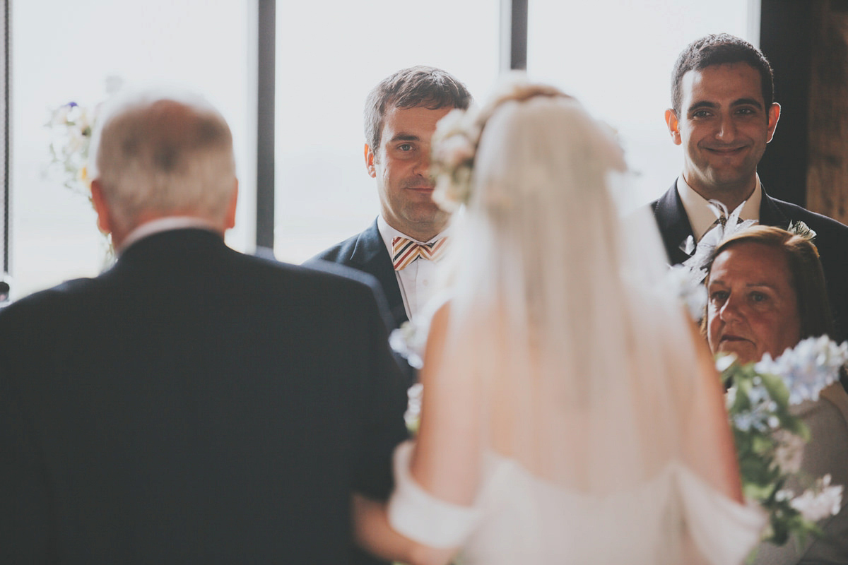 Anya wore a Sabina Motasem gown and floral crown for her vintage seaside inspired wedding. Photography by Eliza Claire.