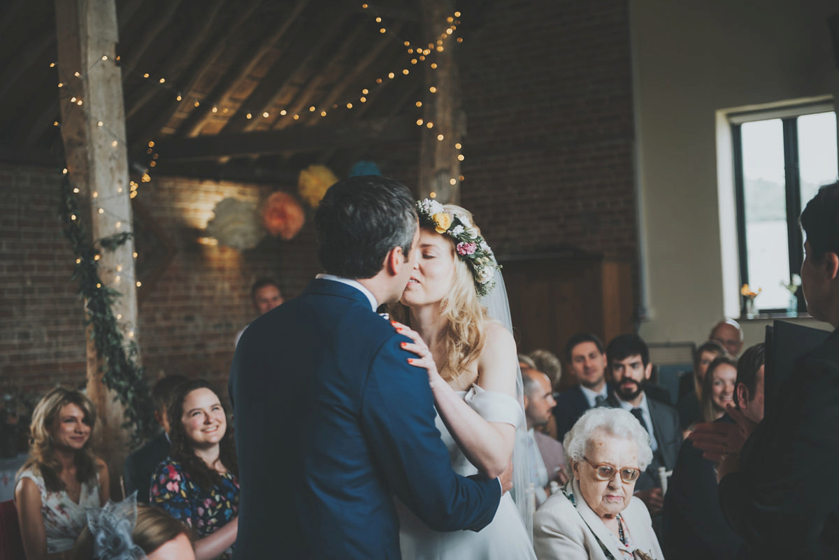 Anya wore a Sabina Motasem gown and floral crown for her vintage seaside inspired wedding. Photography by Eliza Claire.