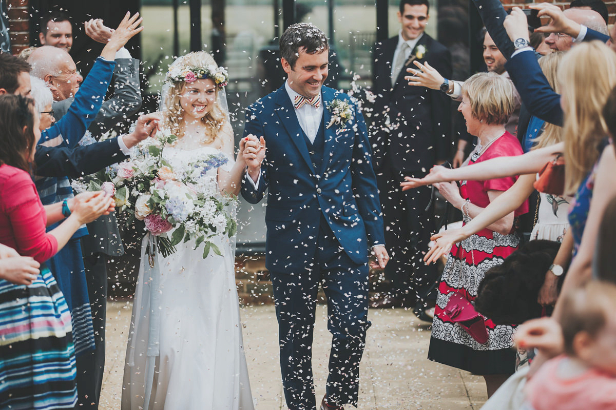 Anya wore a Sabina Motasem gown and floral crown for her vintage seaside inspired wedding. Photography by Eliza Claire.