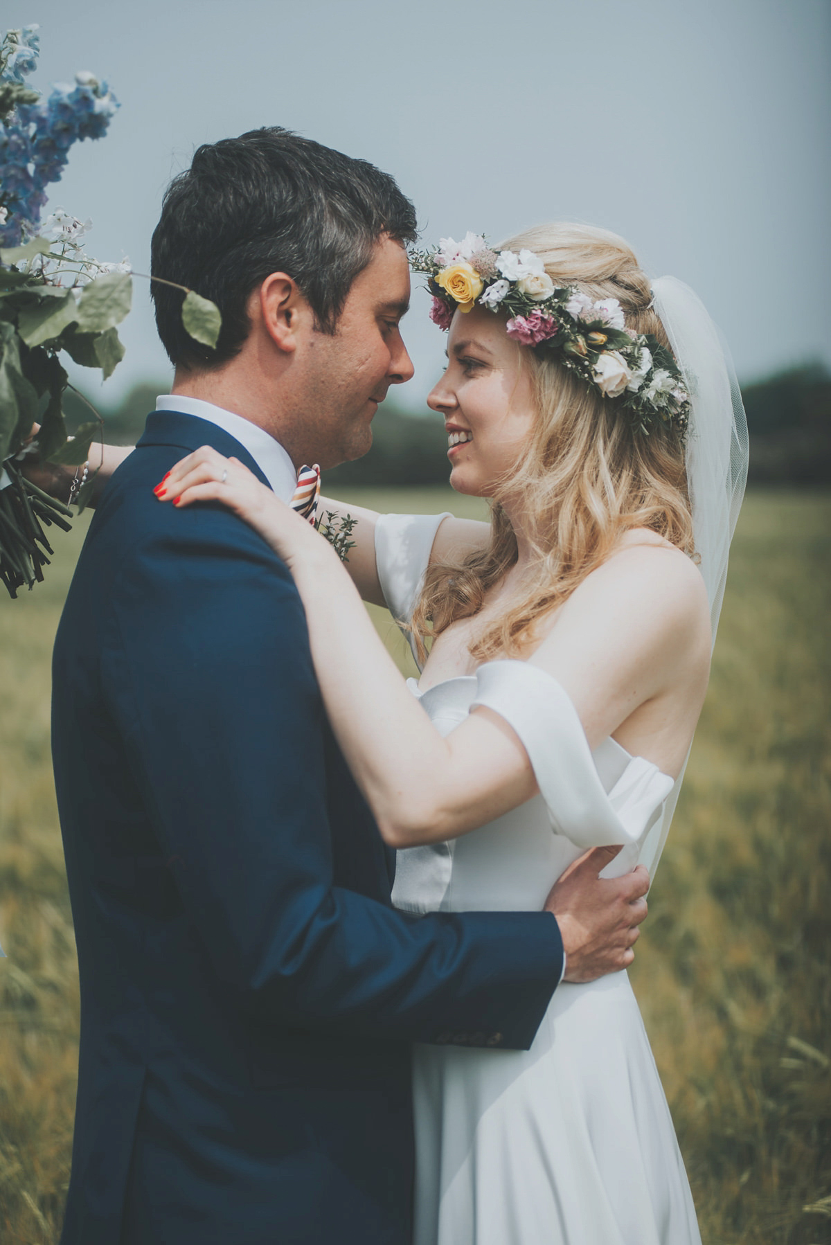 Anya wore a Sabina Motasem gown and floral crown for her vintage seaside inspired wedding. Photography by Eliza Claire.