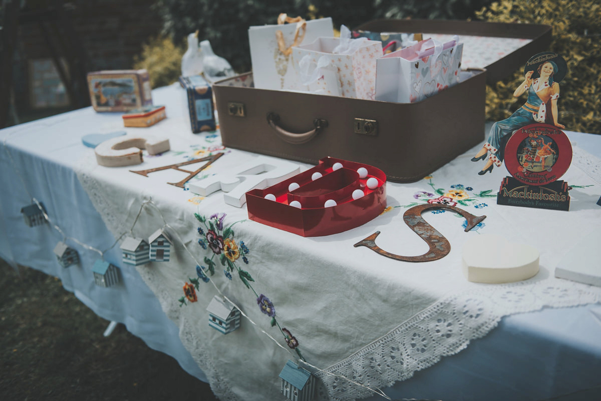 Anya wore a Sabina Motasem gown and floral crown for her vintage seaside inspired wedding. Photography by Eliza Claire.