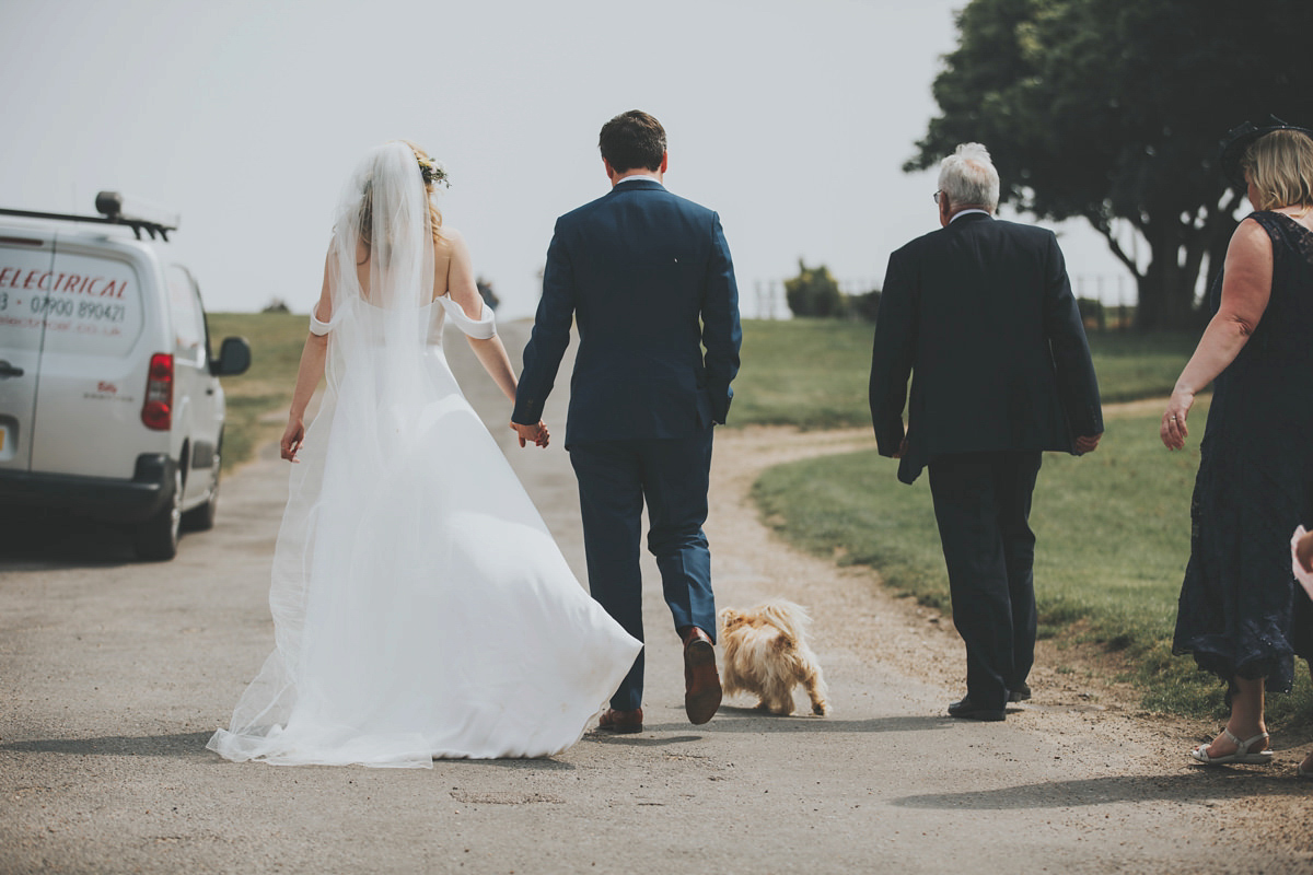 Anya wore a Sabina Motasem gown and floral crown for her vintage seaside inspired wedding. Photography by Eliza Claire.