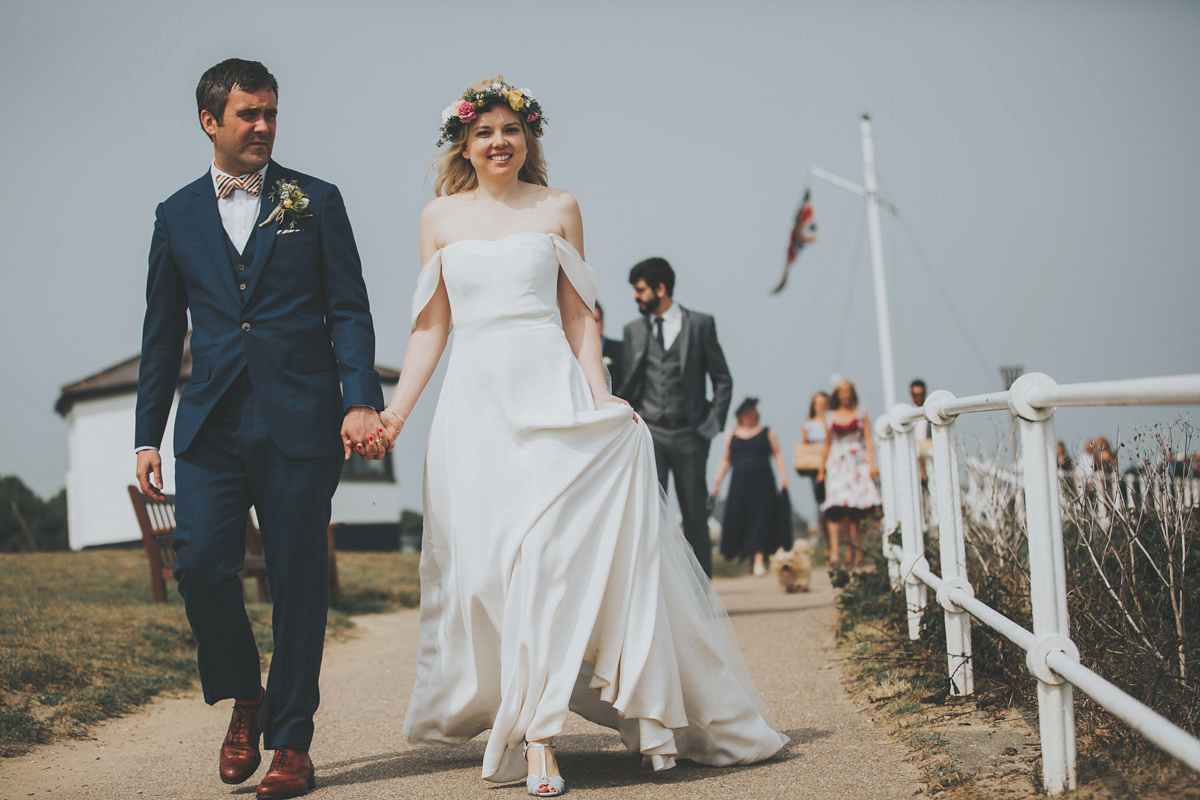 Anya wore a Sabina Motasem gown and floral crown for her vintage seaside inspired wedding. Photography by Eliza Claire.