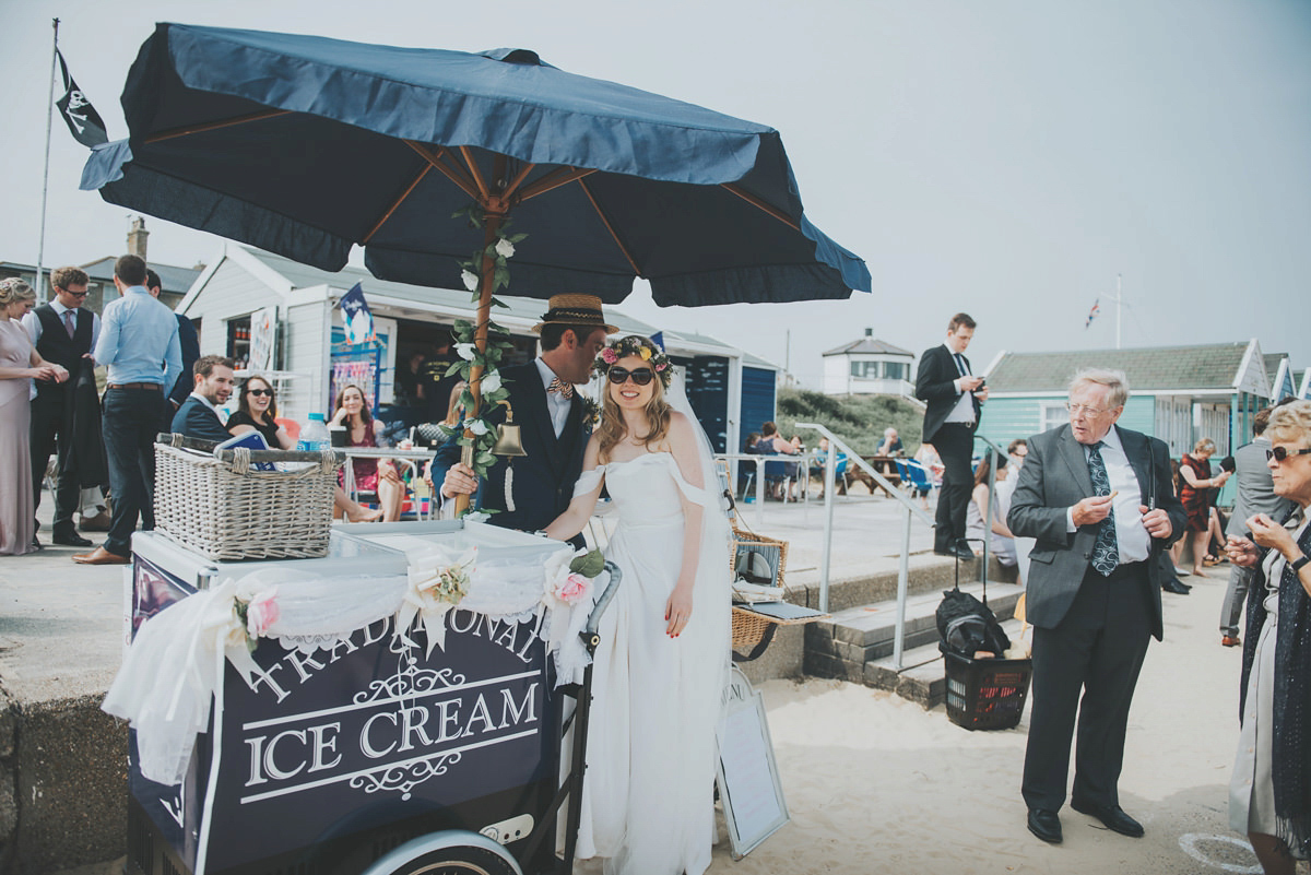 Anya wore a Sabina Motasem gown and floral crown for her vintage seaside inspired wedding. Photography by Eliza Claire.