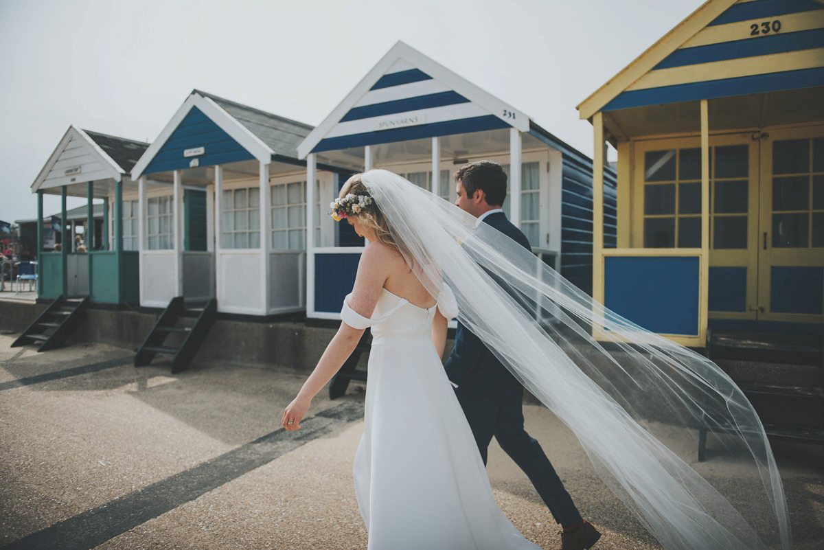 Anya wore a Sabina Motasem gown and floral crown for her vintage seaside inspired wedding. Photography by Eliza Claire.