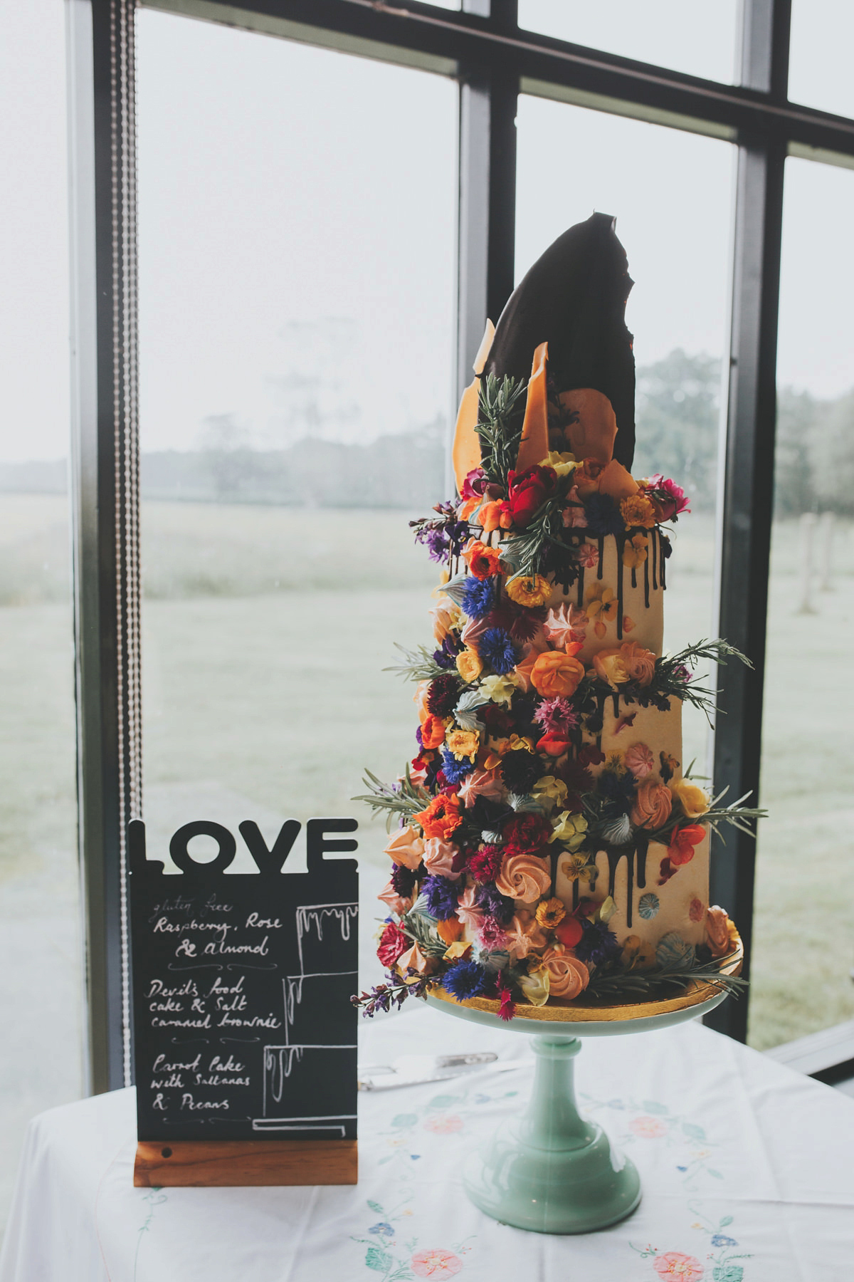 Anya wore a Sabina Motasem gown and floral crown for her vintage seaside inspired wedding. Photography by Eliza Claire.