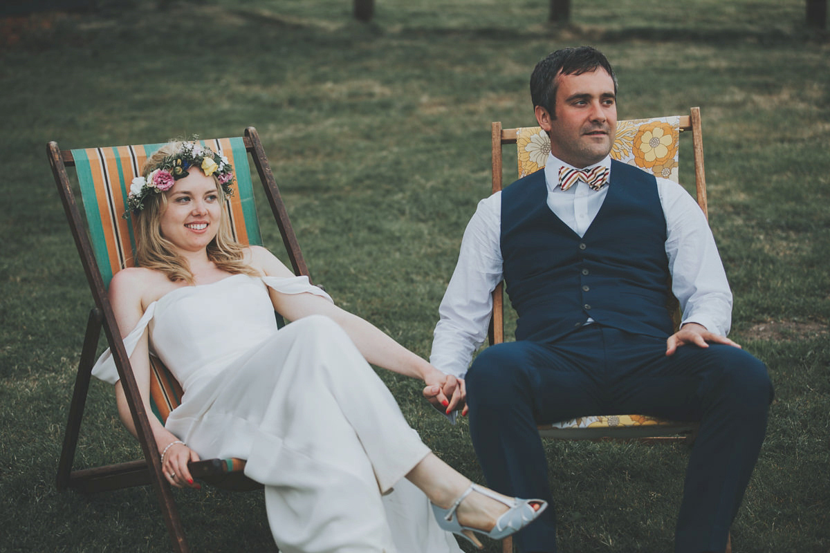 Anya wore a Sabina Motasem gown and floral crown for her vintage seaside inspired wedding. Photography by Eliza Claire.