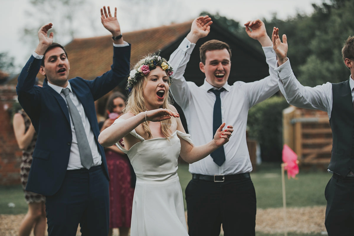 Anya wore a Sabina Motasem gown and floral crown for her vintage seaside inspired wedding. Photography by Eliza Claire.