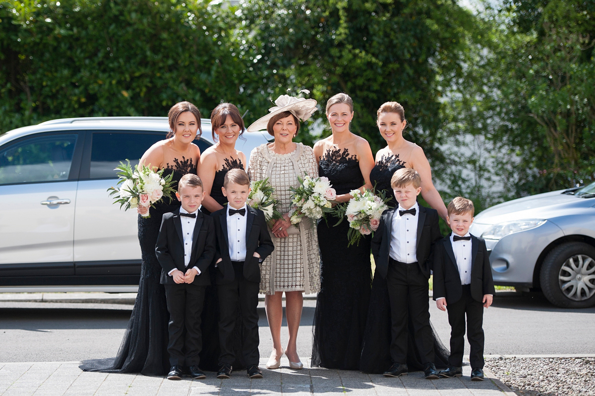 The bride wore a Peter Langner gown and the bridesmaids wore black Pronovias cocktail dresses. Photography by Saray Fyffe.