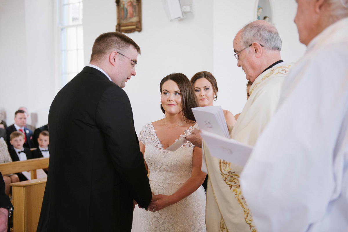 The bride wore a Peter Langner gown and the bridesmaids wore black Pronovias cocktail dresses. Photography by Saray Fyffe.