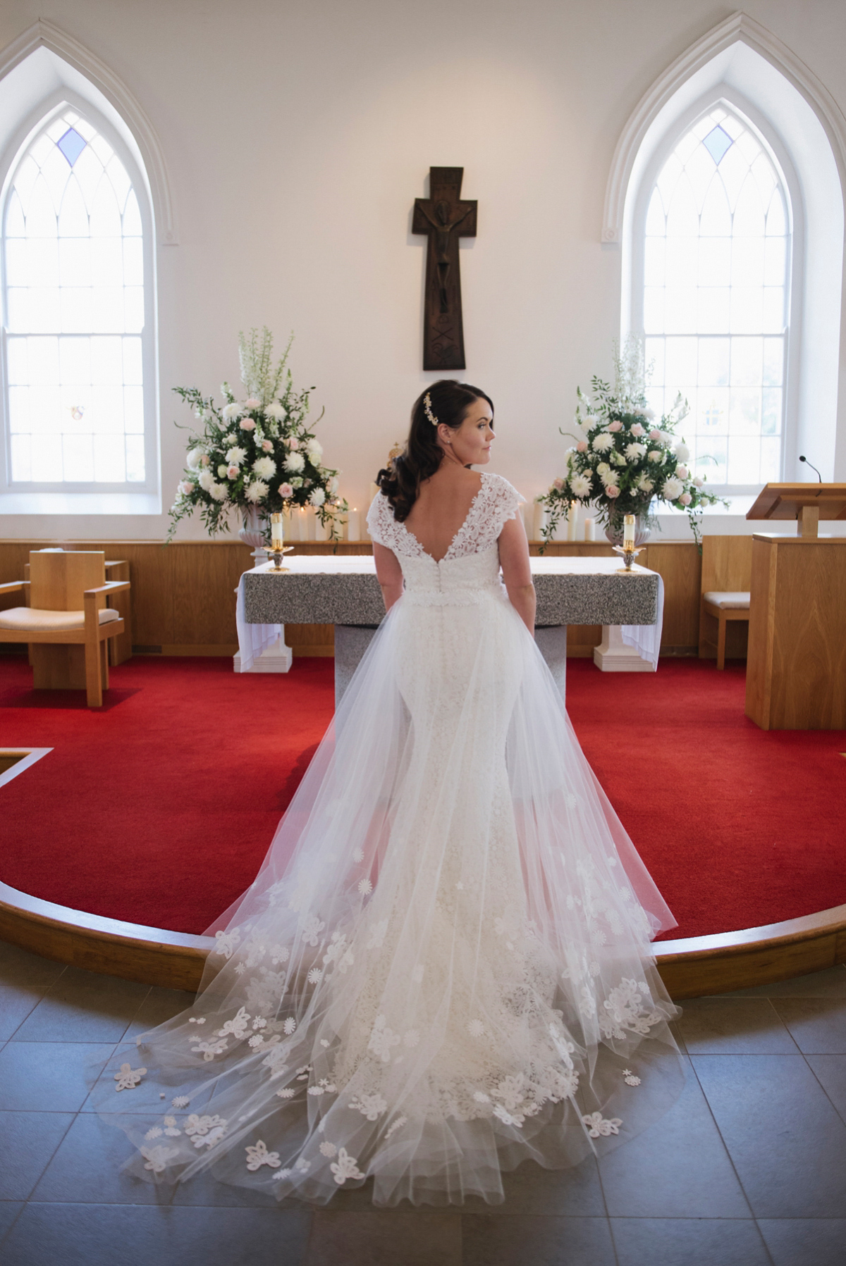 The bride wore a Peter Langner gown and the bridesmaids wore black Pronovias cocktail dresses. Photography by Saray Fyffe.