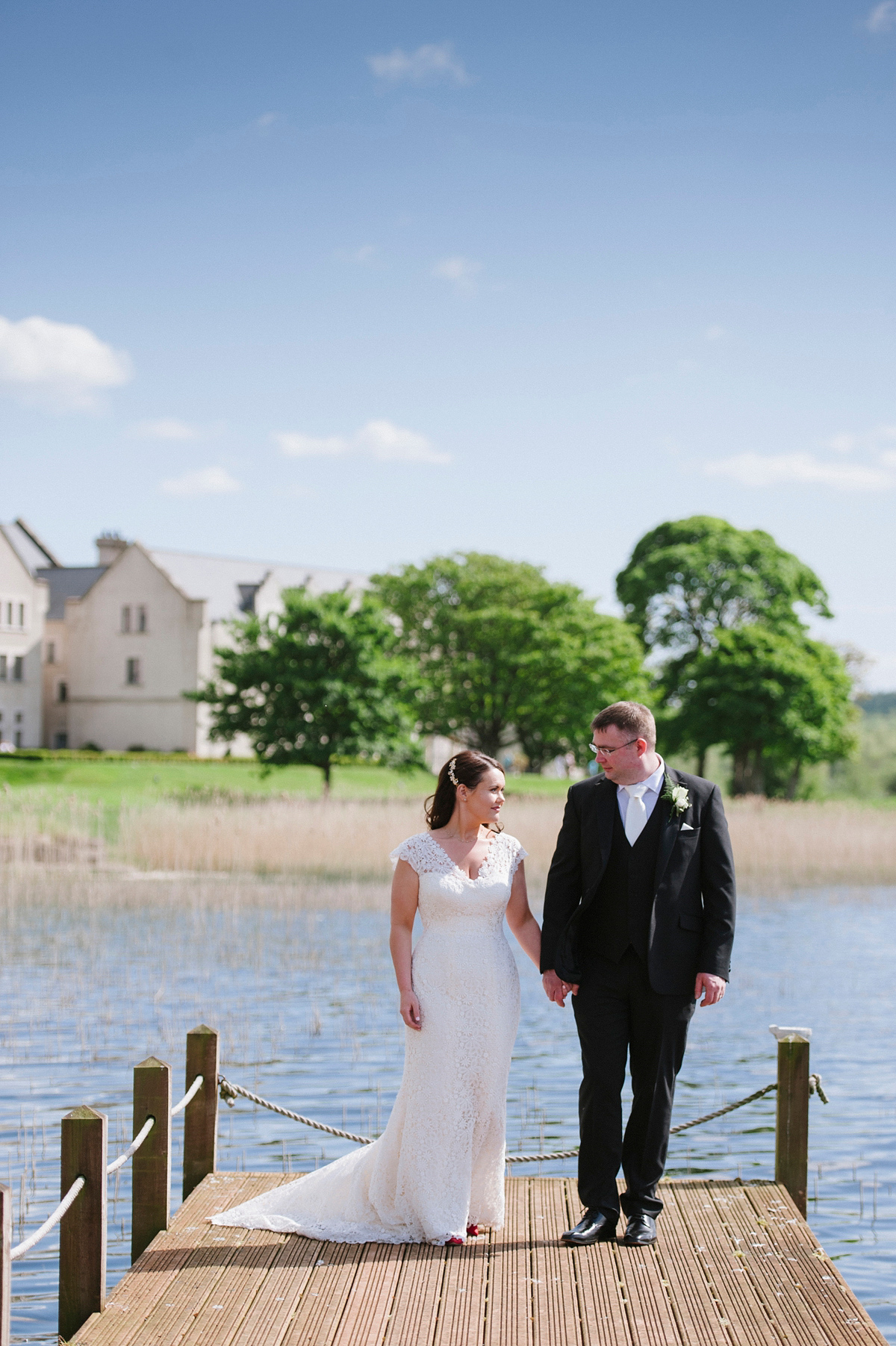 The bride wore a Peter Langner gown and the bridesmaids wore black Pronovias cocktail dresses. Photography by Saray Fyffe.