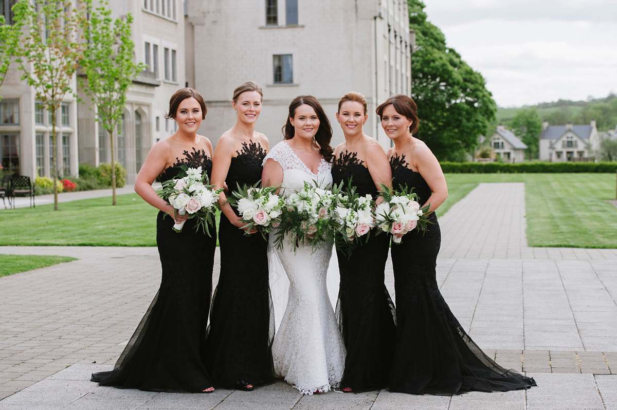 The bride wore a Peter Langner gown and the bridesmaids wore black Pronovias cocktail dresses. Photography by Saray Fyffe.