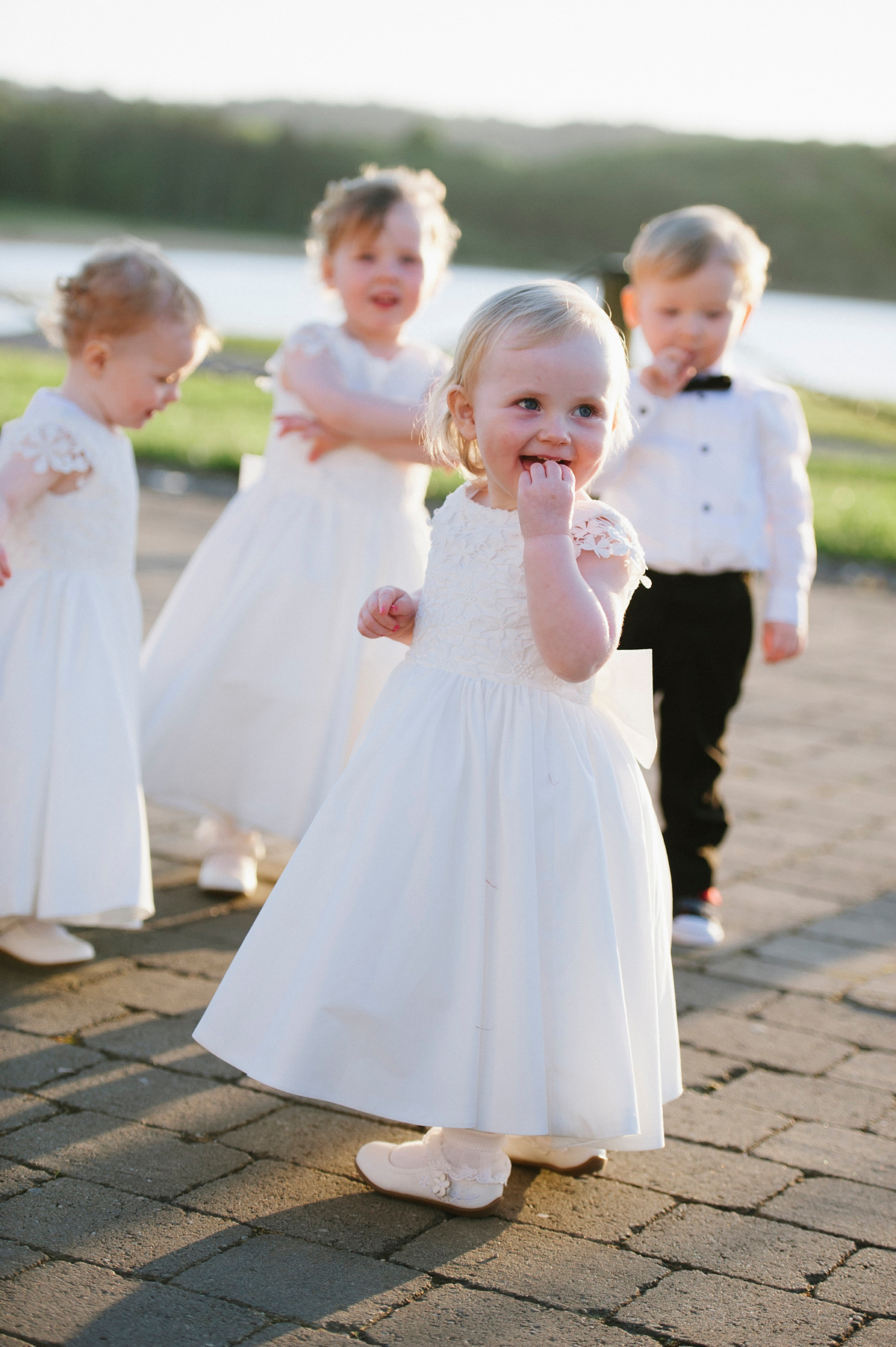 The bride wore a Peter Langner gown and the bridesmaids wore black Pronovias cocktail dresses. Photography by Saray Fyffe.