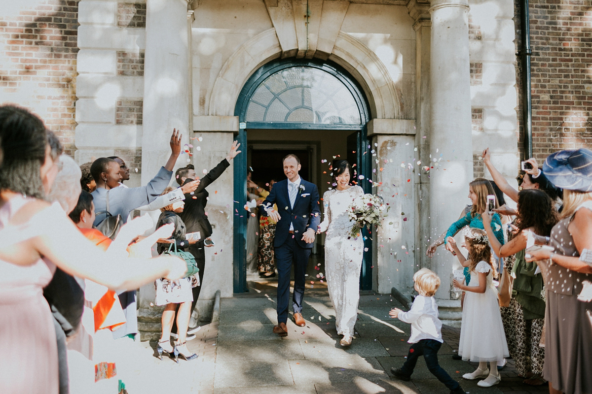 Bride Su wore a Needle & Thread wedding dress for her modern and elegant London wedding. She and her husband Nik met through online dating agency, Guardian Soulmates.