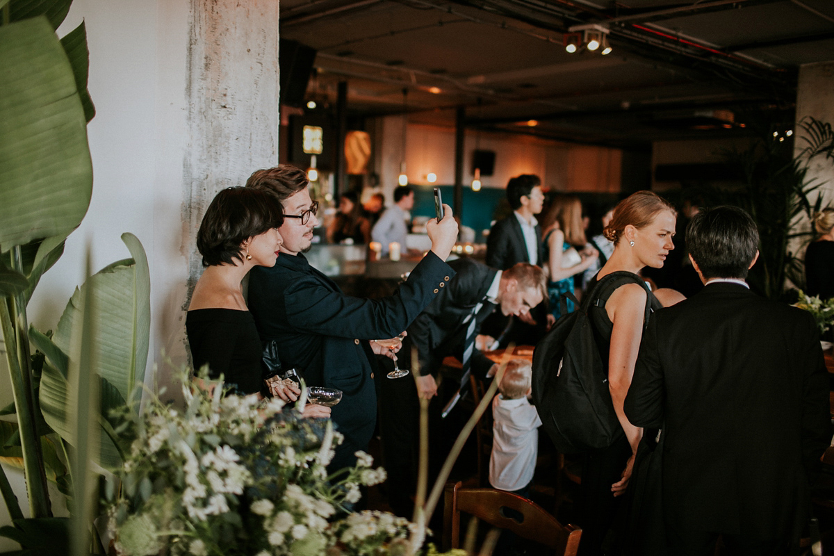 Bride Su wore a Needle & Thread wedding dress for her modern and elegant London wedding. She and her husband Nik met through online dating agency, Guardian Soulmates.