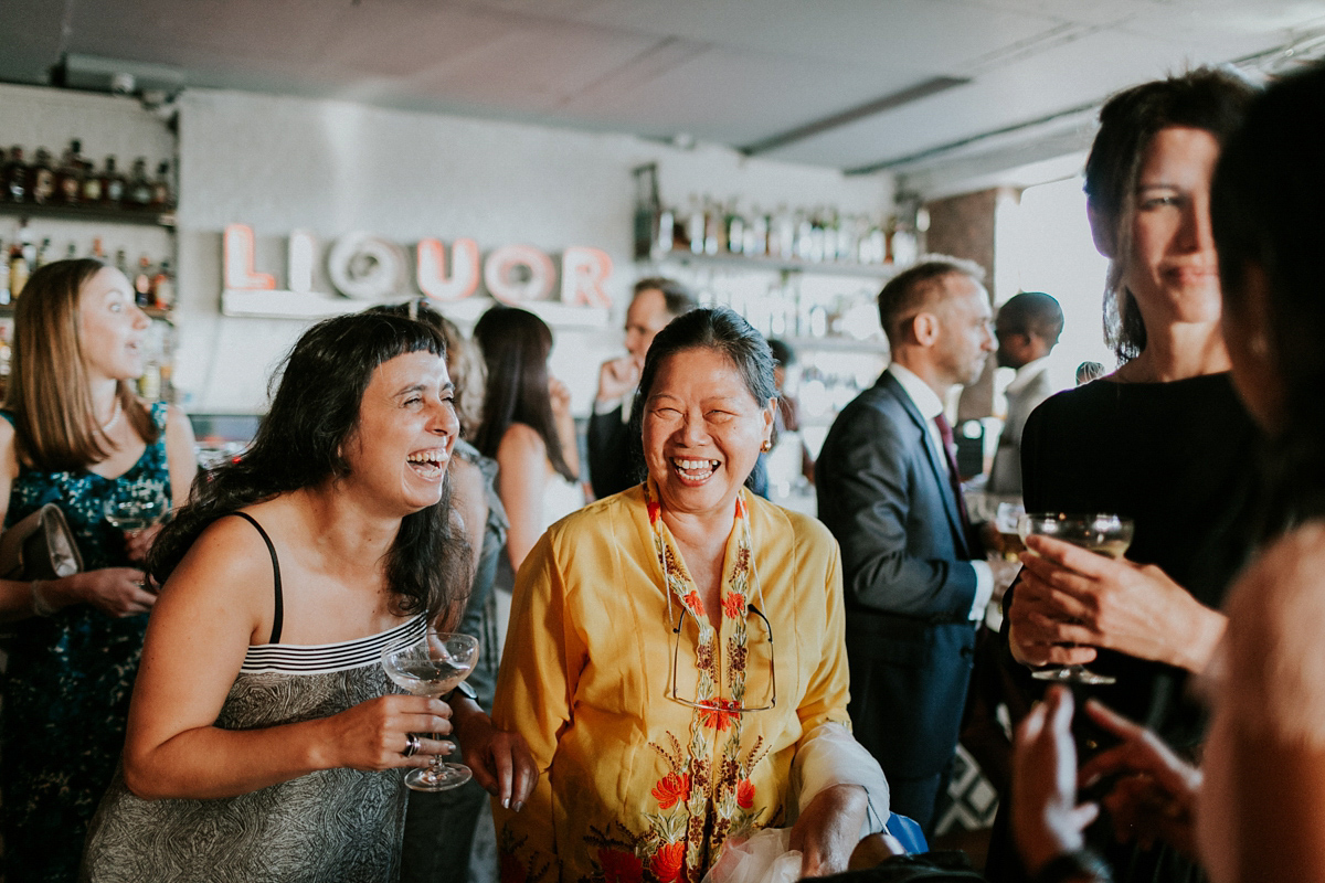 Bride Su wore a Needle & Thread wedding dress for her modern and elegant London wedding. She and her husband Nik met through online dating agency, Guardian Soulmates.