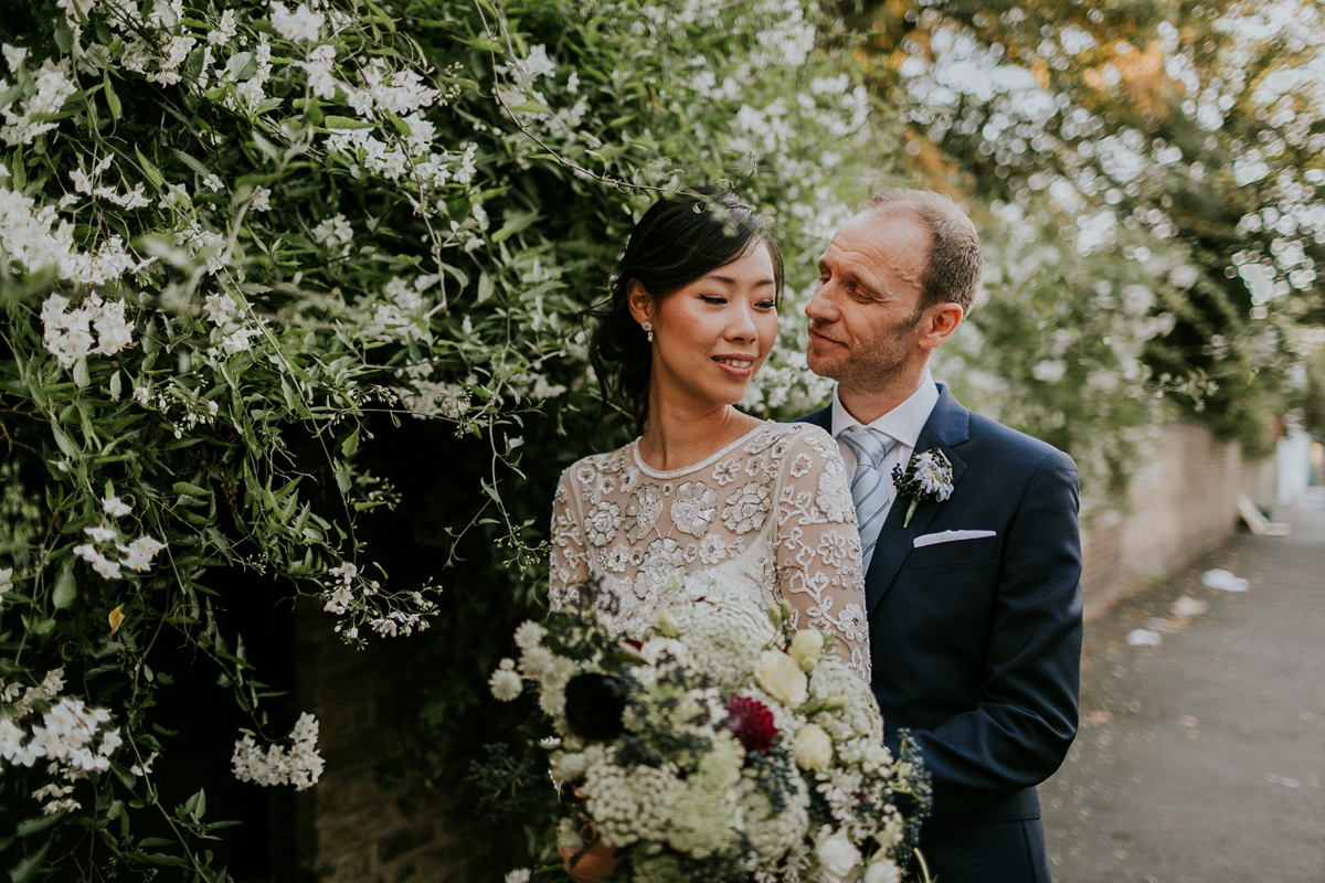 Bride Su wore a Needle & Thread wedding dress for her modern and elegant London wedding. She and her husband Nik met through online dating agency, Guardian Soulmates.
