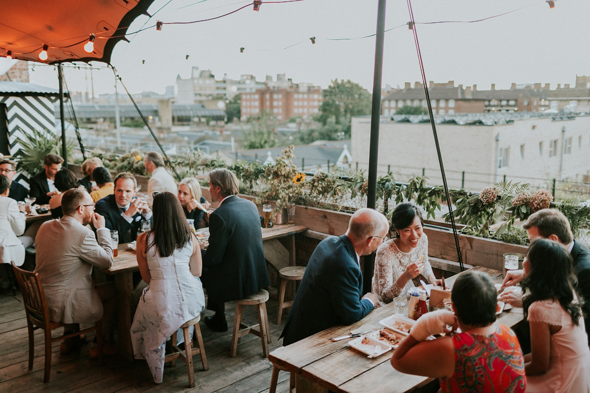 Bride Su wore a Needle & Thread wedding dress for her modern and elegant London wedding. She and her husband Nik met through online dating agency, Guardian Soulmates.