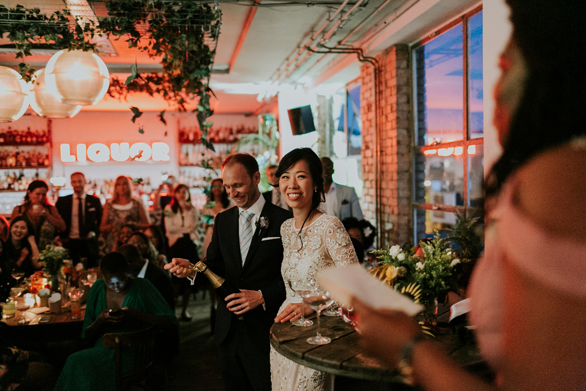 Bride Su wore a Needle & Thread wedding dress for her modern and elegant London wedding. She and her husband Nik met through online dating agency, Guardian Soulmates.