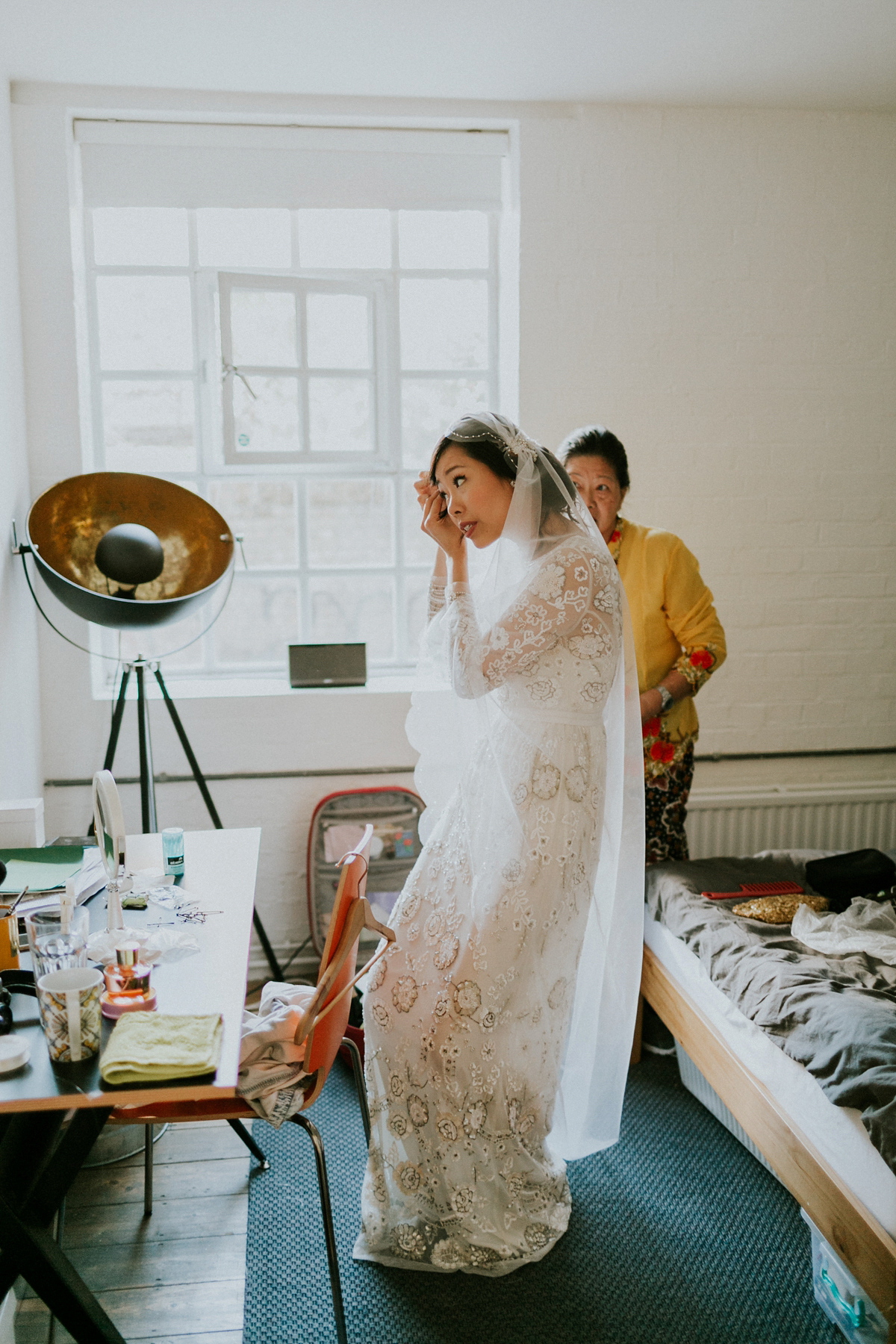 Bride Su wore a Needle & Thread wedding dress for her modern and elegant London wedding. She and her husband Nik met through online dating agency, Guardian Soulmates.