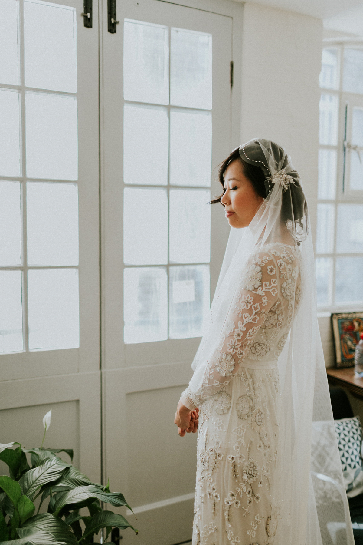 Bride Su wore a Needle & Thread wedding dress for her modern and elegant London wedding. She and her husband Nik met through online dating agency, Guardian Soulmates.