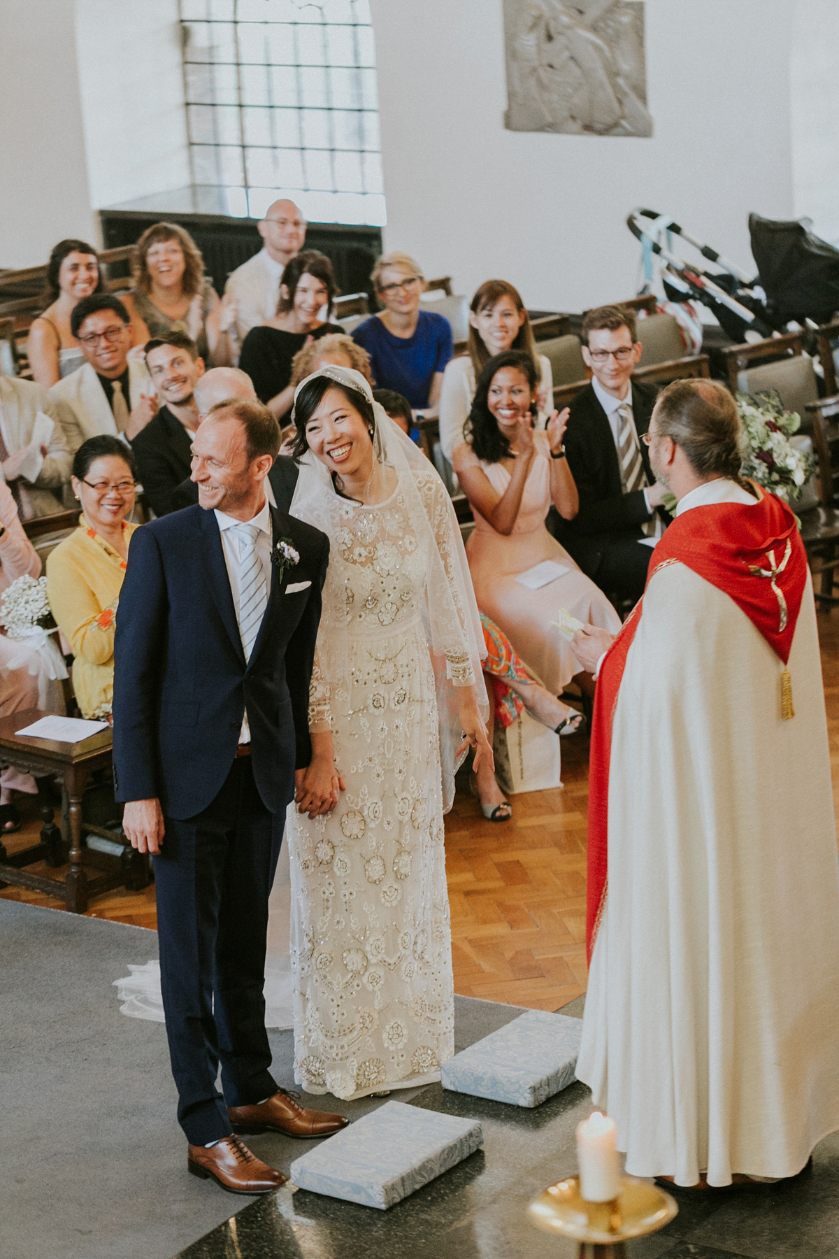 Bride Su wore a Needle & Thread wedding dress for her modern and elegant London wedding. She and her husband Nik met through online dating agency, Guardian Soulmates.