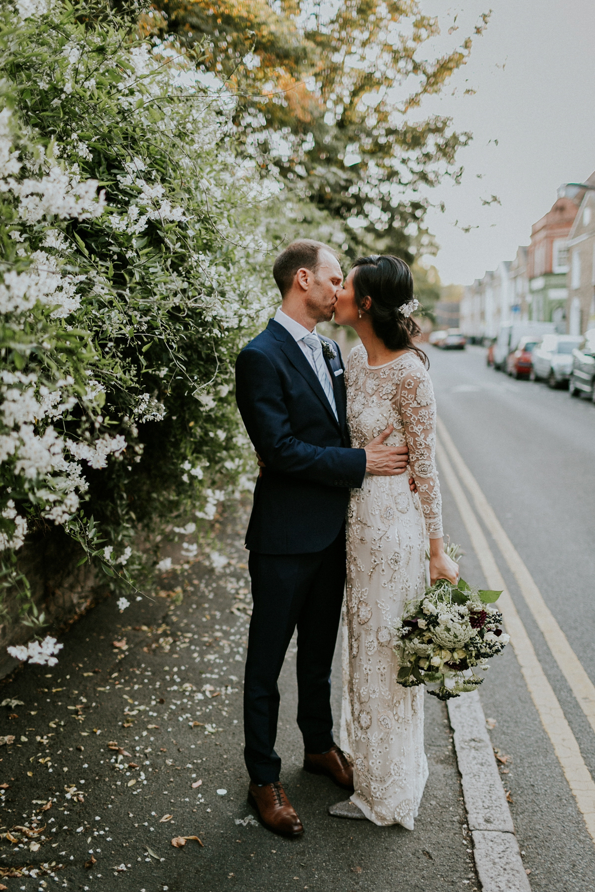 Bride Su wore a Needle & Thread wedding dress for her modern and elegant London wedding. She and her husband Nik met through online dating agency, Guardian Soulmates.