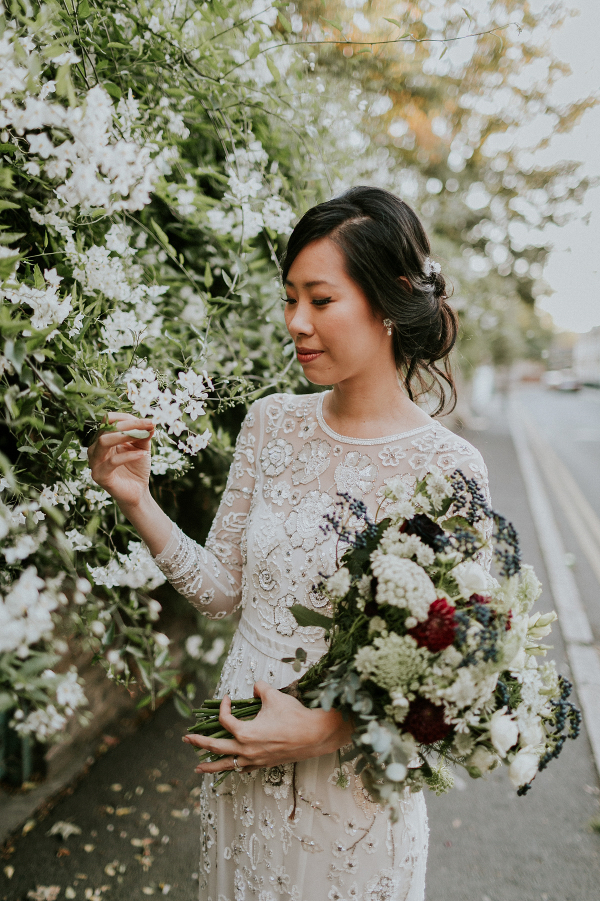 Bride Su wore a Needle & Thread wedding dress for her modern and elegant London wedding. She and her husband Nik met through online dating agency, Guardian Soulmates.