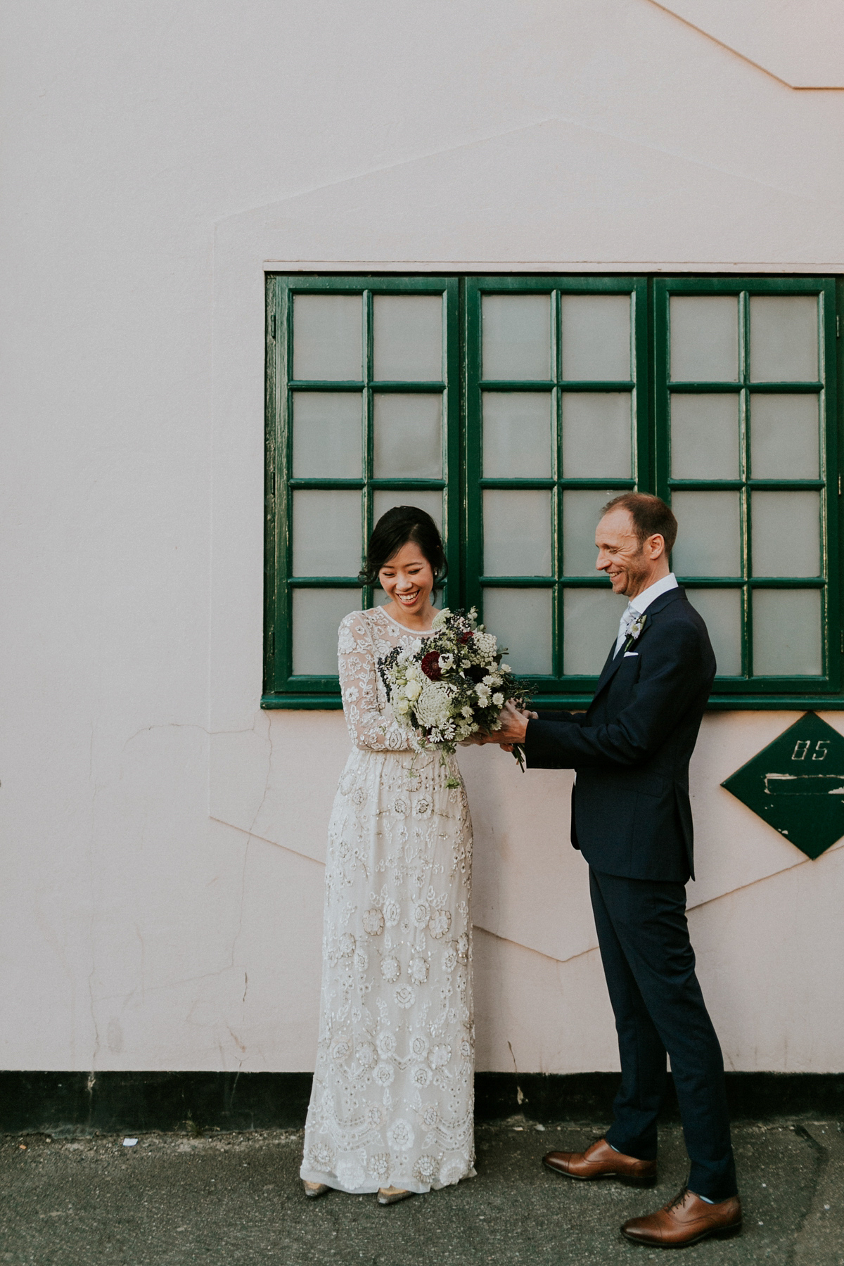 Bride Su wore a Needle & Thread wedding dress for her modern and elegant London wedding. She and her husband Nik met through online dating agency, Guardian Soulmates.