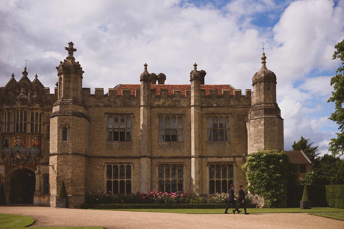 Sarah wore Rosa Clara for her classy and elegant black tie wedding at Hengrave Hall. Photography by Jackson & Co.